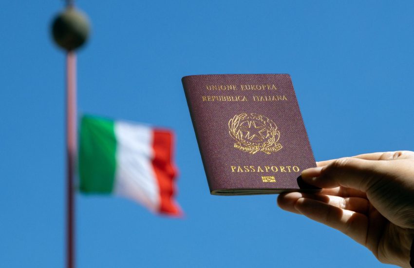 an-italian-passport-with-an-italian-flag-in-the-background